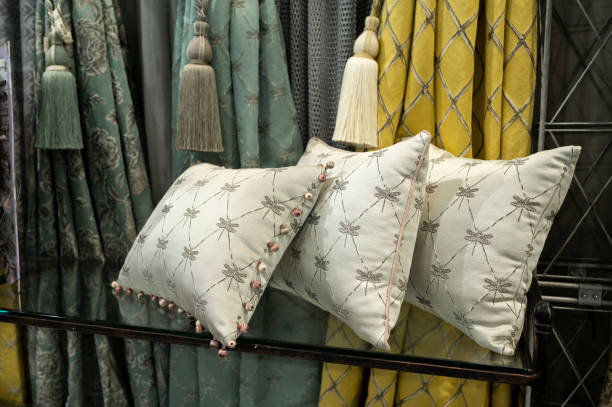 istock Embroidered pillows made of textiles and pompoms 1421123073