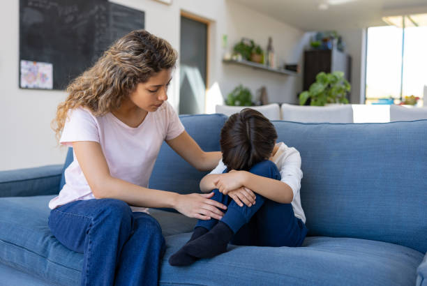 istock Loving mother trying to come down her sad son 1421125373