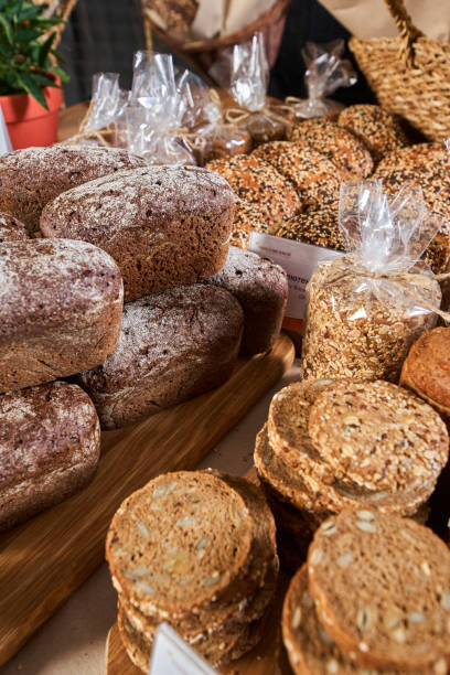 Showcase of sliced bread in the store Showcase of sliced bread in the store close-up shot, freshly baked bread granary toast stock pictures, royalty-free photos & images