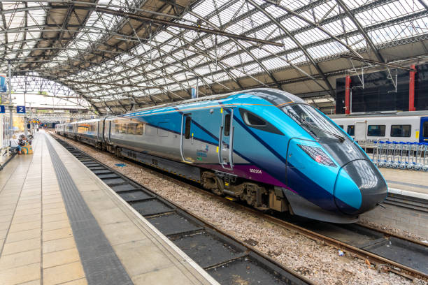 Liverpool United Kingdom Blue TransPennine Express Class 802s high speed diesel electirc bi-mode multiple unit (BMU) train stopped at the Liverpool Lime St station with passengers visible in the background