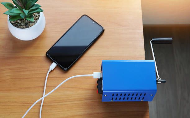 istock Charger device Portable electricity generator, hand rotation to charge other devices 1421133031