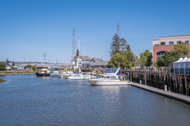 Boats Along the Petaluma River Petaluma, CA - May 20, 2022: View of boats along the Petaluma River. petaluma stock pictures, royalty-free photos & images