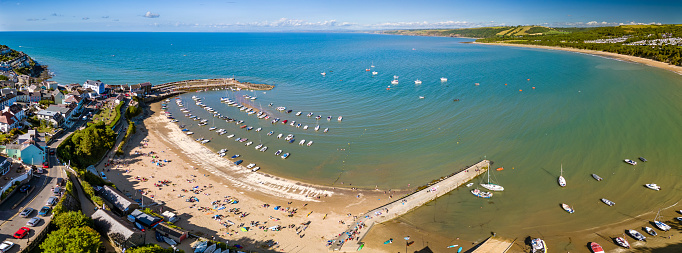 Panoramic aerial view of the colorful Welsh seaside town of New Quay (Ceredigion)