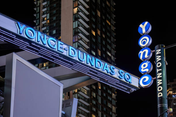 Sign for Yonge-Dundas Square at night in Toronto, Canada Toronto, Canada - August 11, 2022: Sign for Yonge-Dundas Square, a public square modeled after Times Square, is one of the busiest intersections in Canada, with its many attractions. There is a plan to rename Dundas Street because the man it was named for played a role in delaying the abolition of the Transatlantic Slave Trade in the 1790s. toronto dundas square stock pictures, royalty-free photos & images
