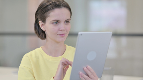 Woman Using Tablet, Browsing Internet