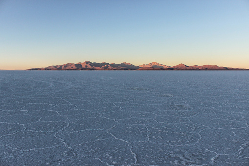 Sunrise in Uyuni with mountains in the background, Bolivia