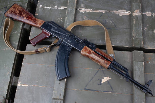 istock Kalashnikov AK47 gun on army green crate 1421152909