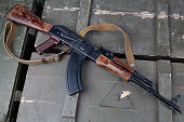 Kalashnikov AK47 gun on army green crate