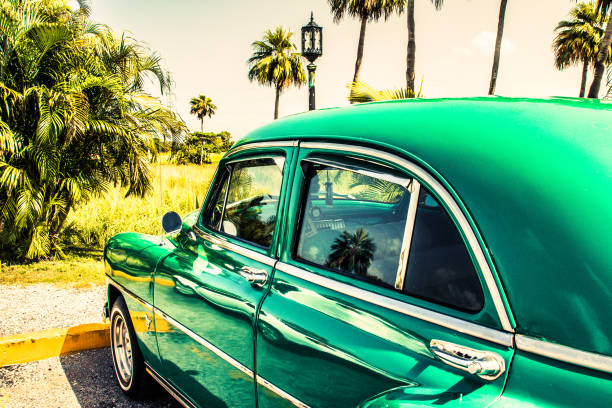 Havana, Cuba - July 09 2018 : Nostalgic with vintage cars parked at a highway stop in the middle of the country.