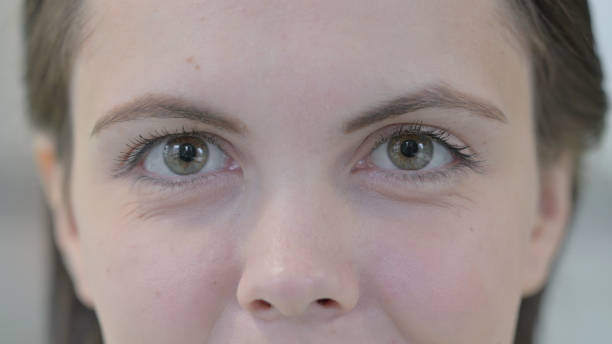 istock Close up of Female Blinking Eyes 1421159720