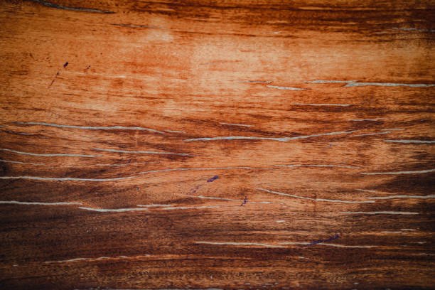 Dark wood texture background surface with old natural pattern. Walnut wood texture. Close up walnut planks texture background.