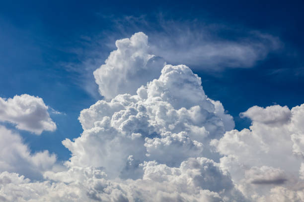Closeup, cumulus clouds. Blue sky in background.