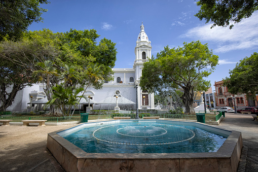 Fountain at Plaza Las Delicias, Ponce, Puerto Rico. The Ponce Cathedral in the background.