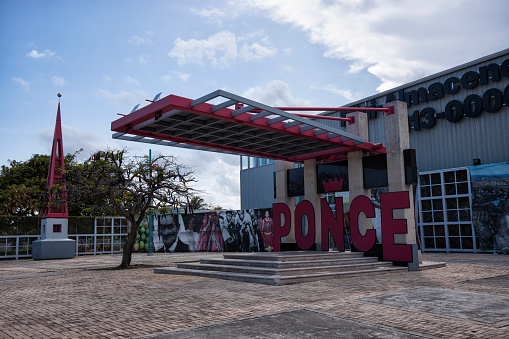 Big Red Ponce sign in front of a storage company, Ponce, Puerto Rico