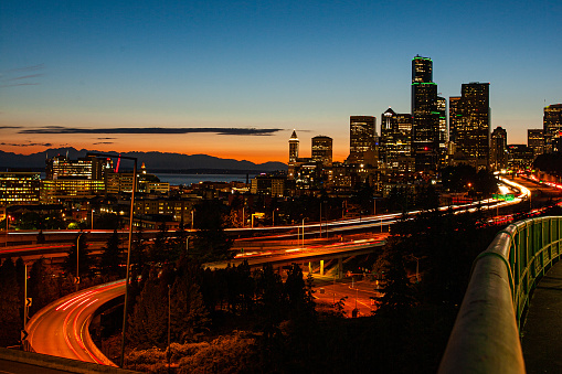 Seattle Washington downtown cityscape at night time. Shot in the summer of 2022, with copy space over the city skyscrapers.