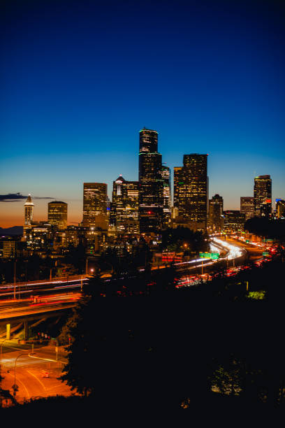 downtown seattle city skylines and interstate freeways converge at sunset, seattle, washington, usa - seattle night skyline architecture and buildings imagens e fotografias de stock