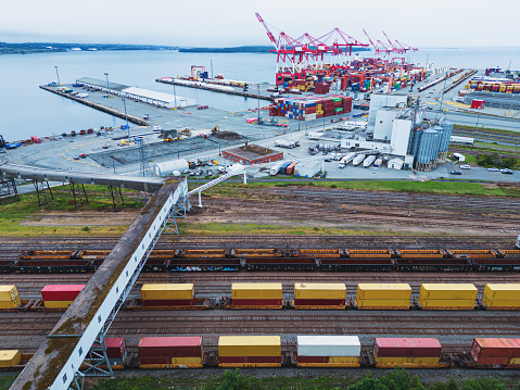 Aerial drone view of a railyard & container dock.