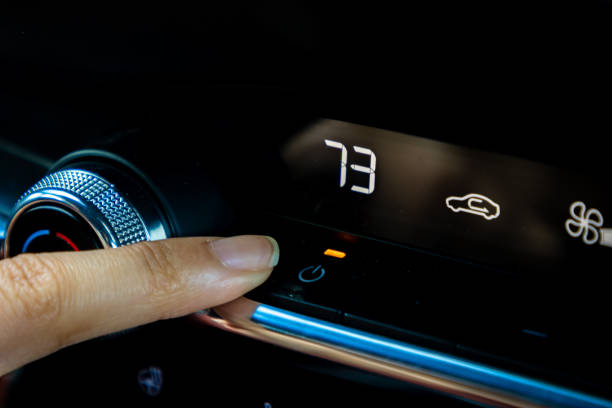 istock Woman's finger controlling air conditioning 1421183329