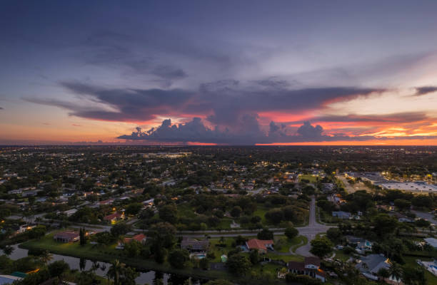 Aerial drone view of suburban Miami neighborhood with an epic sunset in the back Aerial drone view of suburban Miami neighborhood with an epic sunset in the back kendall stock pictures, royalty-free photos & images