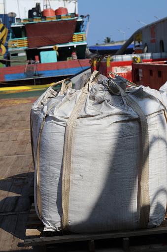 jumbo bags containing chemichal sodium chloride and Sodium hydrogen carbonate and various other hazardous cargoes from offshore drilling residues transported by supply ships. contains food supply