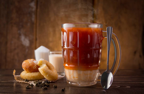 istock original hot thai milk tea drink with sweet donuts , thai beverage 1421191140