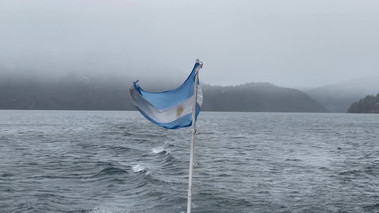 Flag of Argentina on the Stern of a Cruise Ship in Lake Lacar, near San Martin de los Andes, Patagonia, Argentina. 4K Resolution.