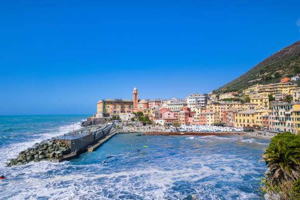 Small harbor in Nervi, Genoa, bordered by colorful buildings stock photo