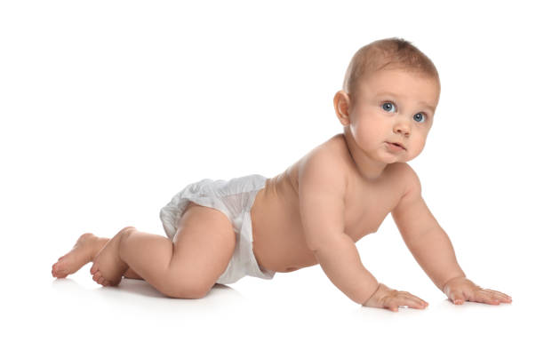 istock Cute little baby in diaper crawling on white background 1421199731