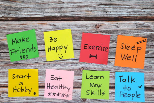 Healthy lifestyle and physical, emotional, mental social and intellectual wellbeing concept. Colorful sticky notes reminder set in wooden background Healthy lifestyle and physical, emotional, mental social and intellectual wellbeing concept. Colorful sticky notes reminder set in wooden background life balance stock pictures, royalty-free photos & images