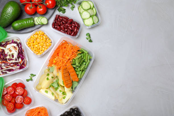 istock Set of plastic containers with fresh food on light table, flat lay. Space for text 1421200956