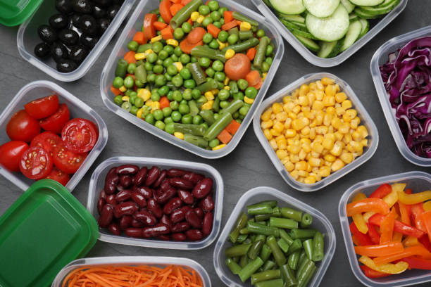 istock Set of plastic containers with fresh food on black table, flat lay 1421201337