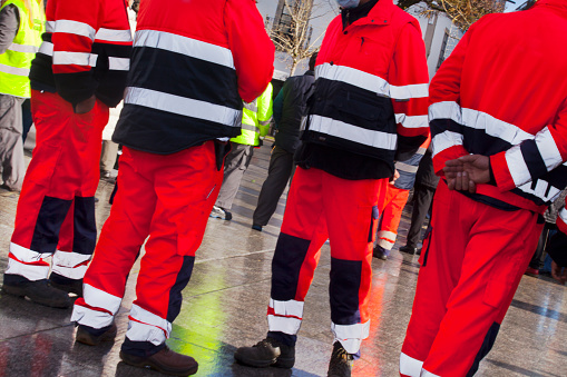 Group of safety and protection workers wearing reflective uniforms during celebration event in Vilalba, Lugo province, Galicia, Spain. Protección civil.