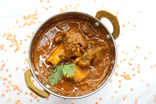 Dal Gosht or Daal Gosht is one of the very popular Mutton Recipes in India. Mutton cooked with spices and mixed lentils. Mutton dalcha with Tur dal and masoor dal. Copy space. Mutton curry in Kadai.