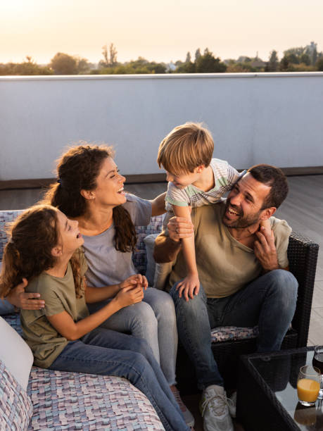 istock Happy family having fun on a patio. 1421211539
