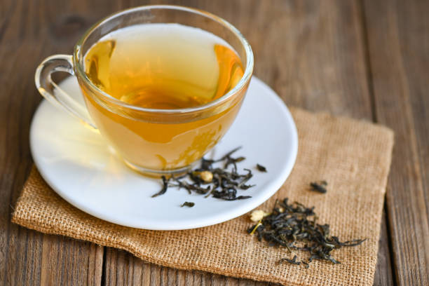 istock tea herbal on tea cup with chinese dry tea on wooden table 1421213376