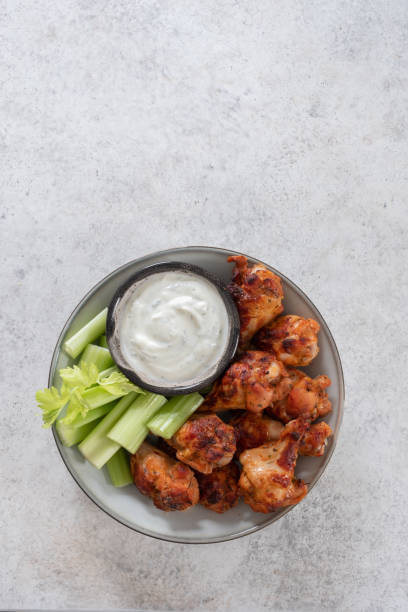 istock buffalo chicken wings with celery and beer 1421216200