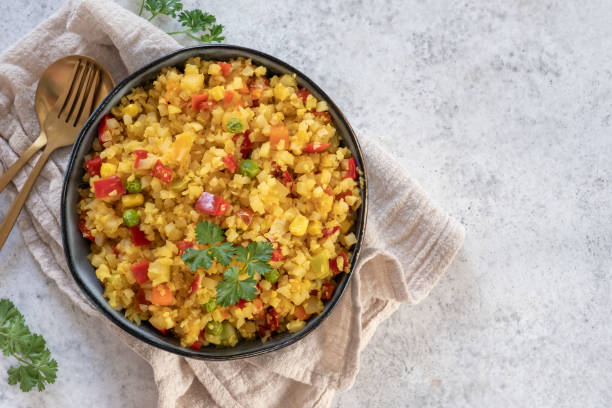 istock Cauliflower rice with vegetables 1421216226