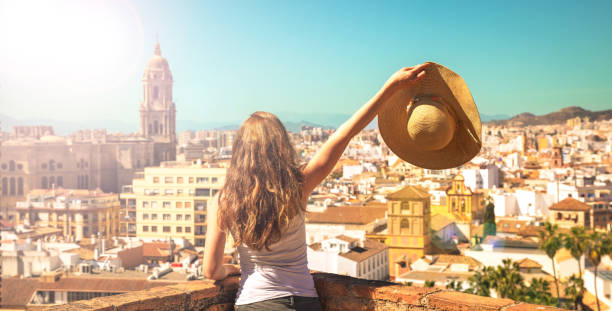 donna che guarda la vista panoramica di malaga- andalusia in spagna - provincia di málaga foto e immagini stock