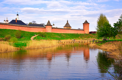 Suzdal, Russia, 05.08.2022. The walls of the Kremlin on the river bank, a monument of Russian architecture of the XVII century