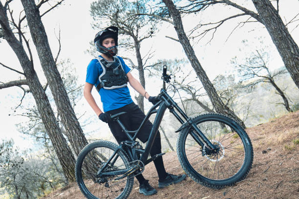 istock Teenager in forest practicing downhill biking. 1421220351