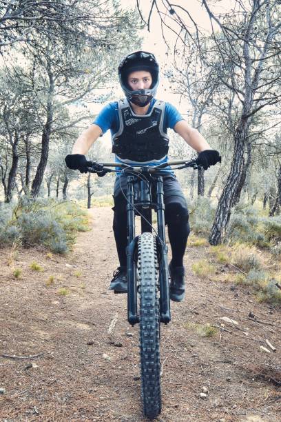 istock Teenager in forest practicing downhill biking. 1421220559