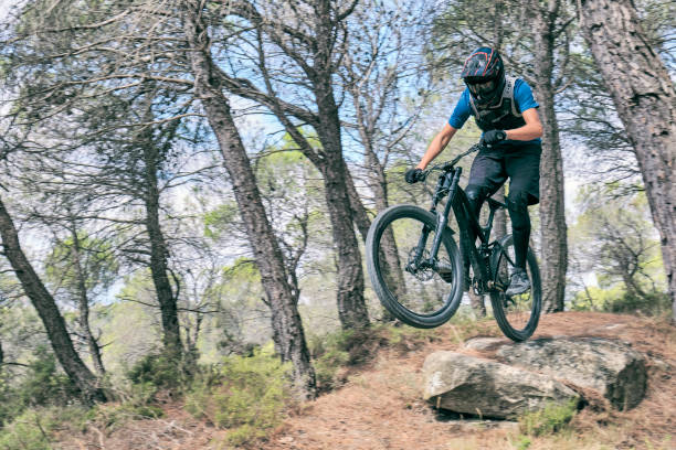 istock Teenager in forest practicing downhill biking. 1421220634