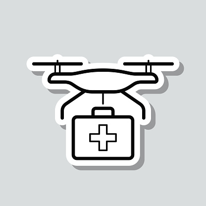 istock Medical drone with first aid kit. Icon sticker on gray background 1421223835