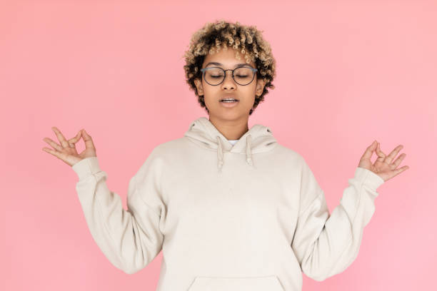 istock African American woman meditating 1421224440