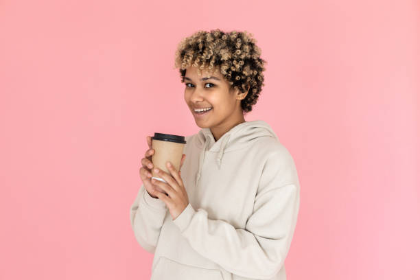 istock African American woman drinking coffee in studio 1421224444