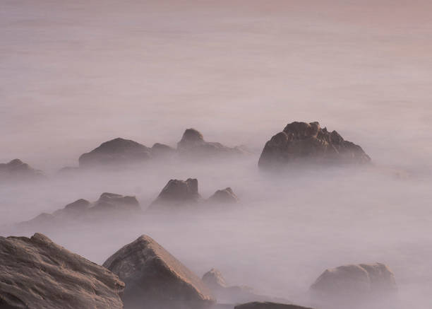 istock stones in the sea at sunset (basque country, spain) 1421224468