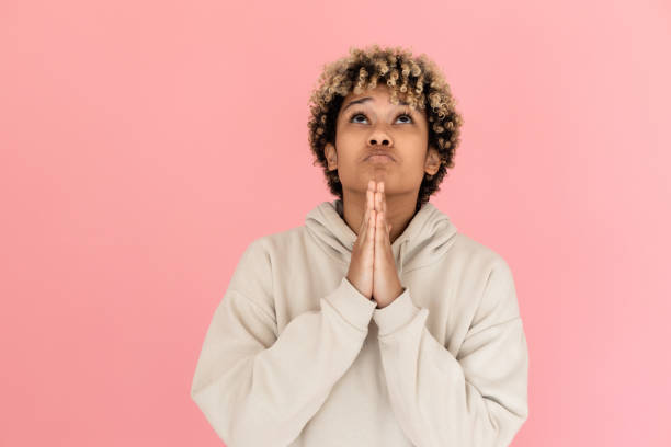 istock African American woman making pleading gesture 1421224528