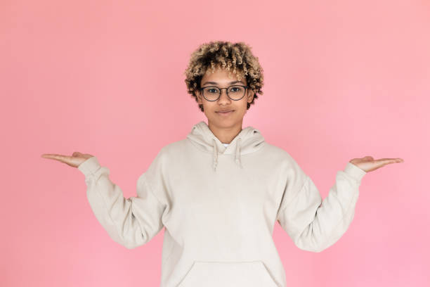 istock African American woman pointing copy space with two hands 1421224705