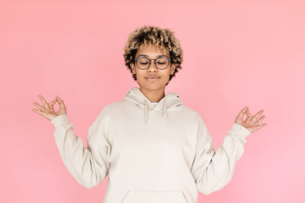 African American woman meditating in studio