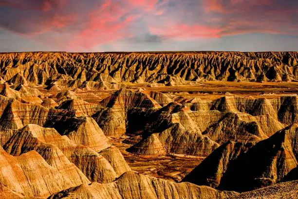 Photo of Beautiful Badlands National Park in South Dakota with sunset view in the background